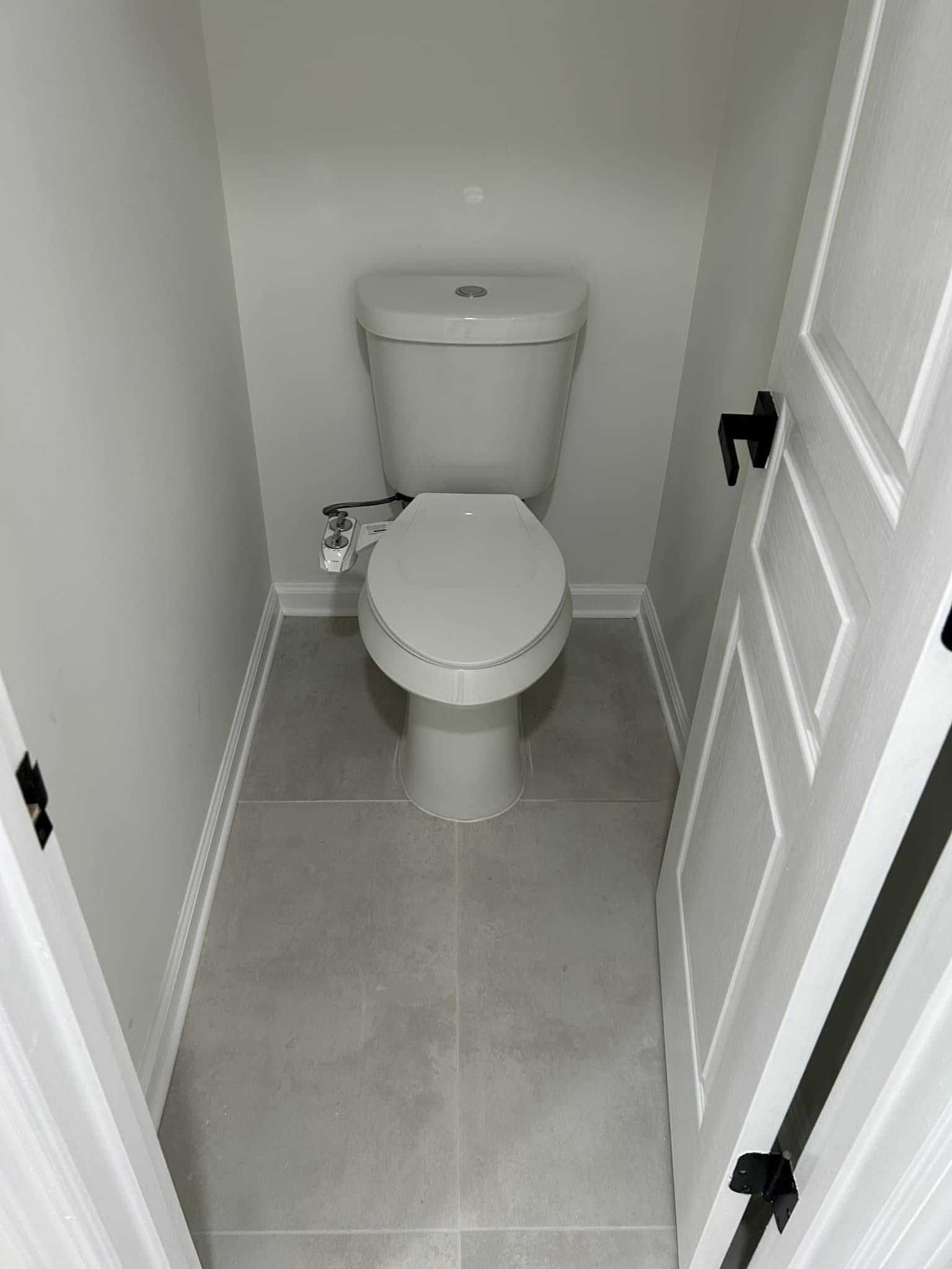 Spotless powder room cleaned by Jojo's Cleaning Service