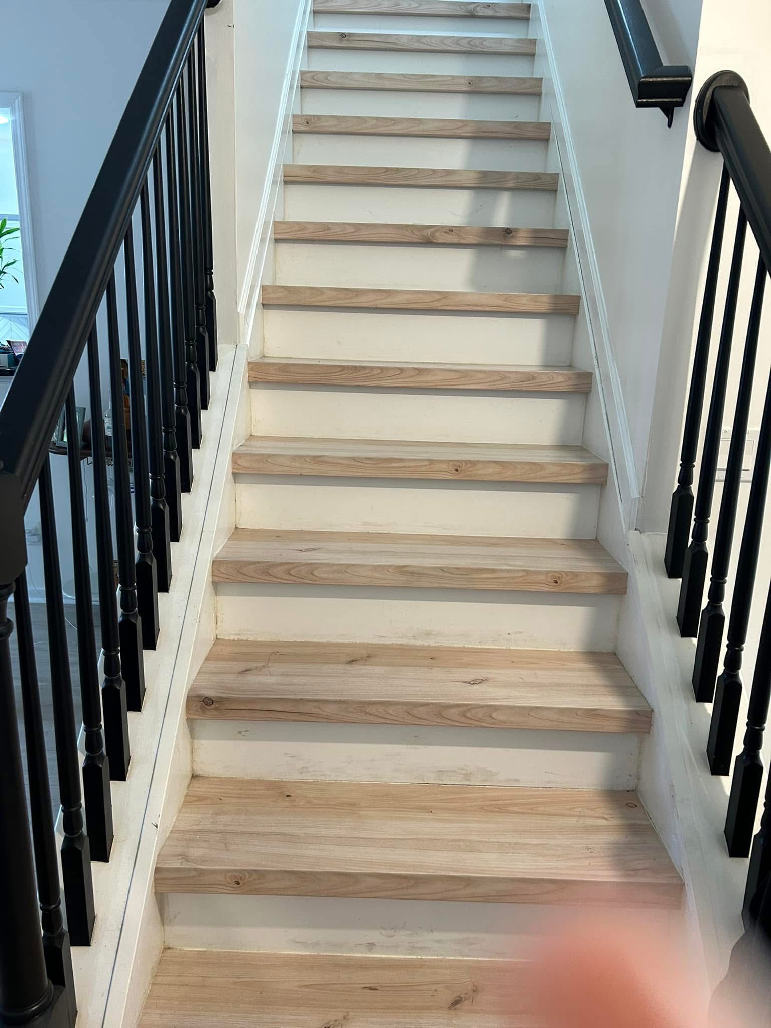 Clean hardwood staircase by Jojo's Cleaning Service